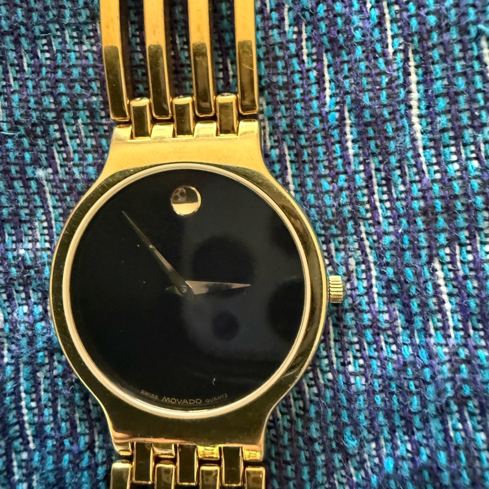 Movado Luxurious Gold and Black Timepiece